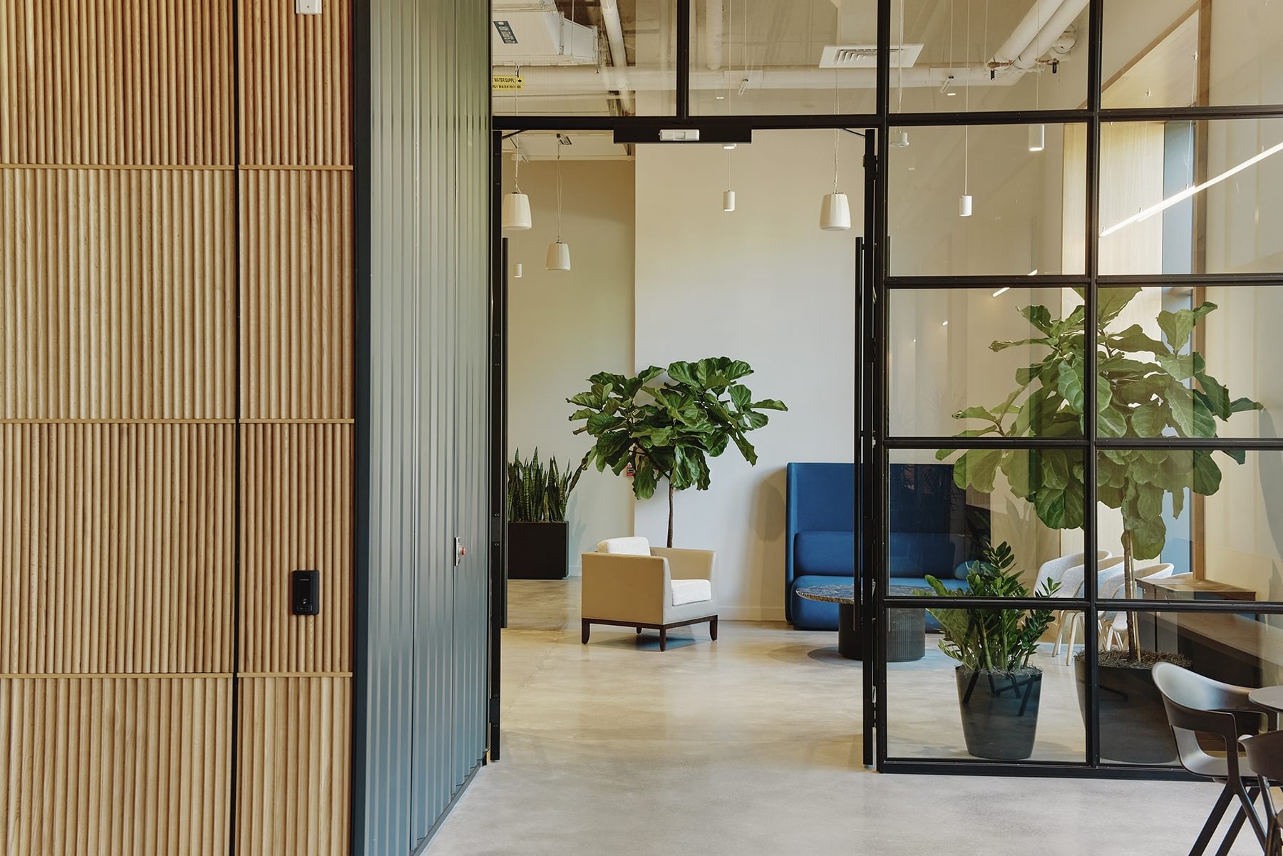 A view through an open door in a glass wall on the first floor of The Engine.
