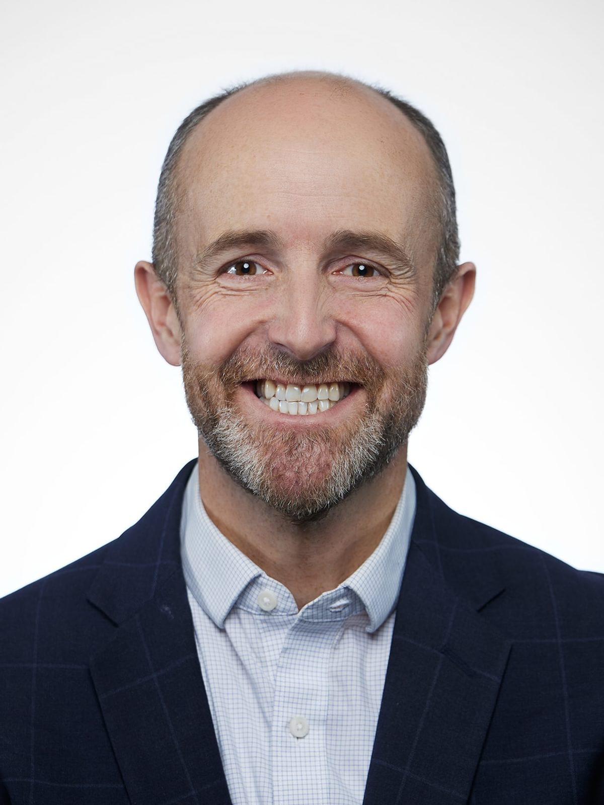 A headshot of The Engine's Chief Growth Officer Ben Downing.