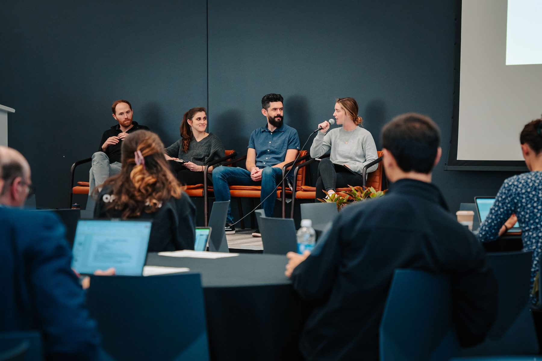 A panel speaks in front of a captivated audience at the Blueprint Showcase.