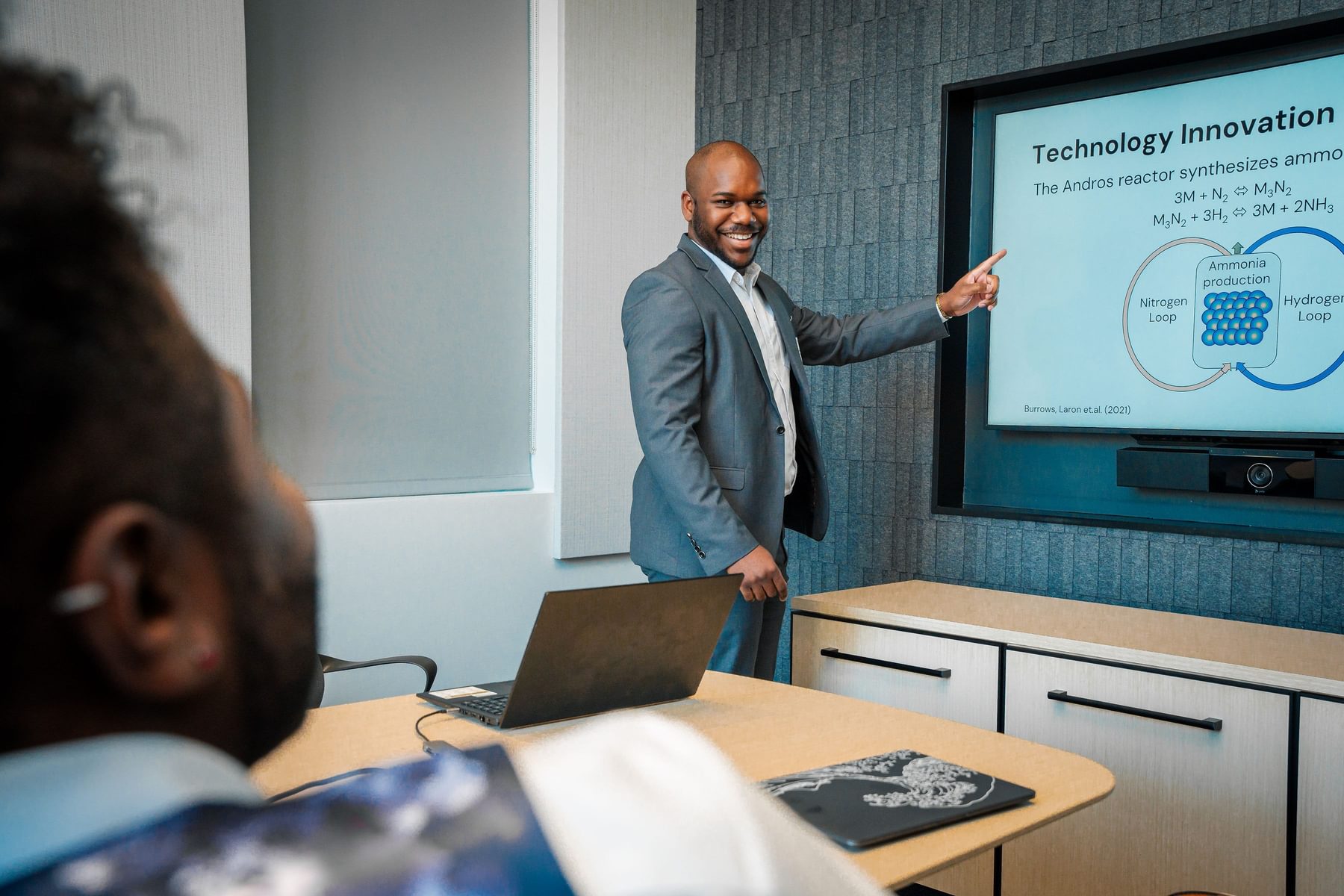 A man presents his company's innovation during a Blueprint session.