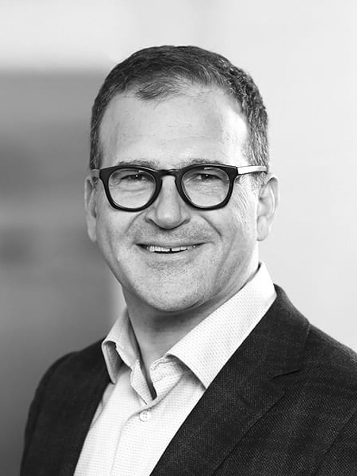 A headshot of Sahir Surmeli, Chair of the Sustainable Energy, Infrastructure & Industrials Practice at Mintz and an expert in residence at The Engine.