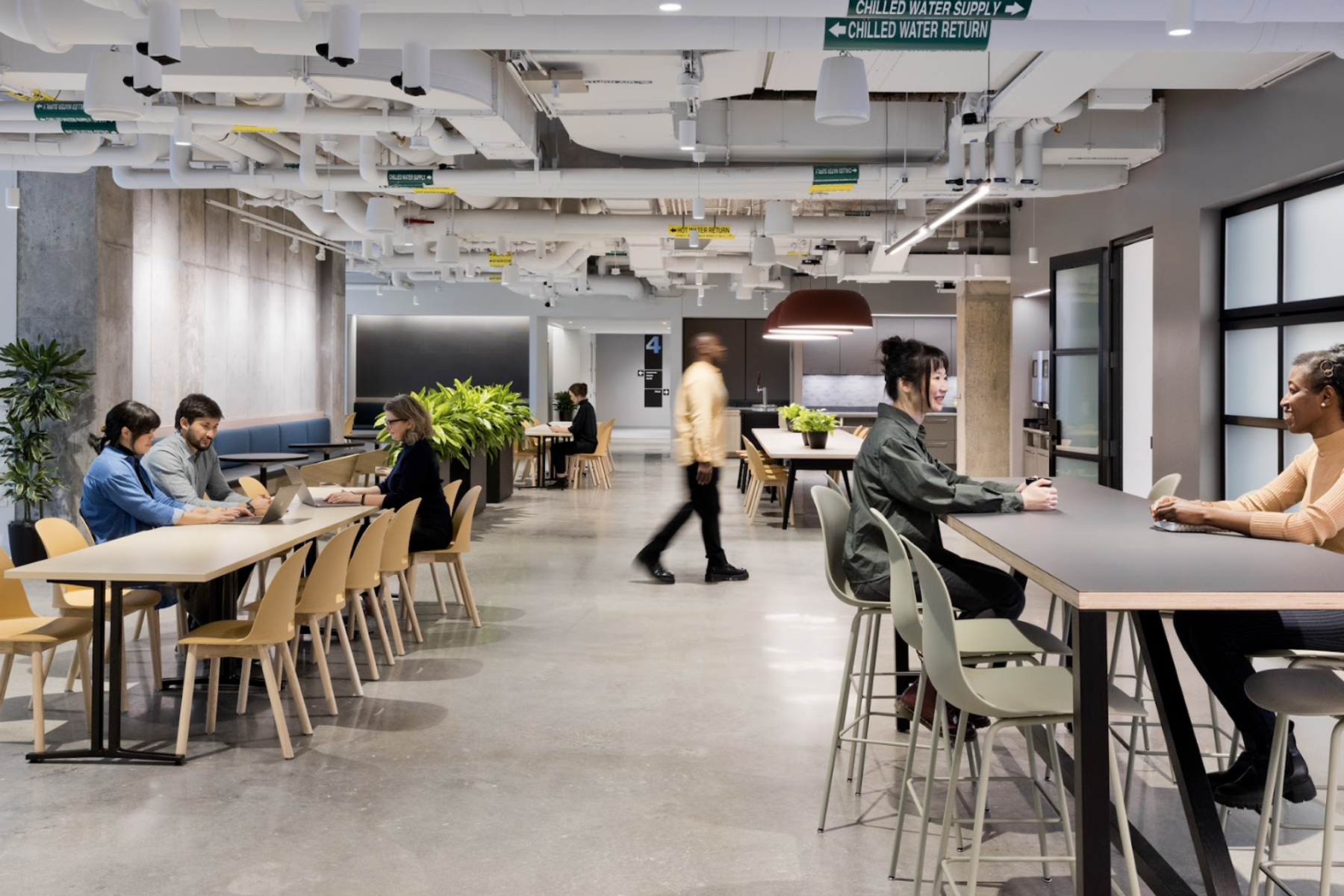 A view of residents working in the cafe on the fourth floor of The Engine.