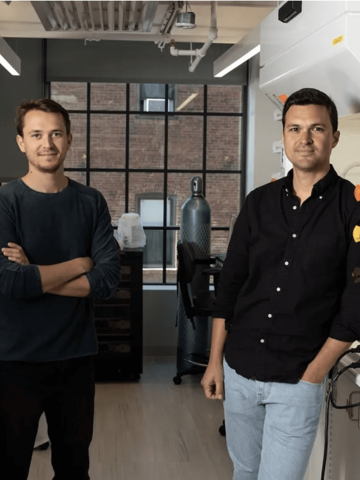 The founders of carbon-neutral aviation fuel company Lydian pose in their lab.