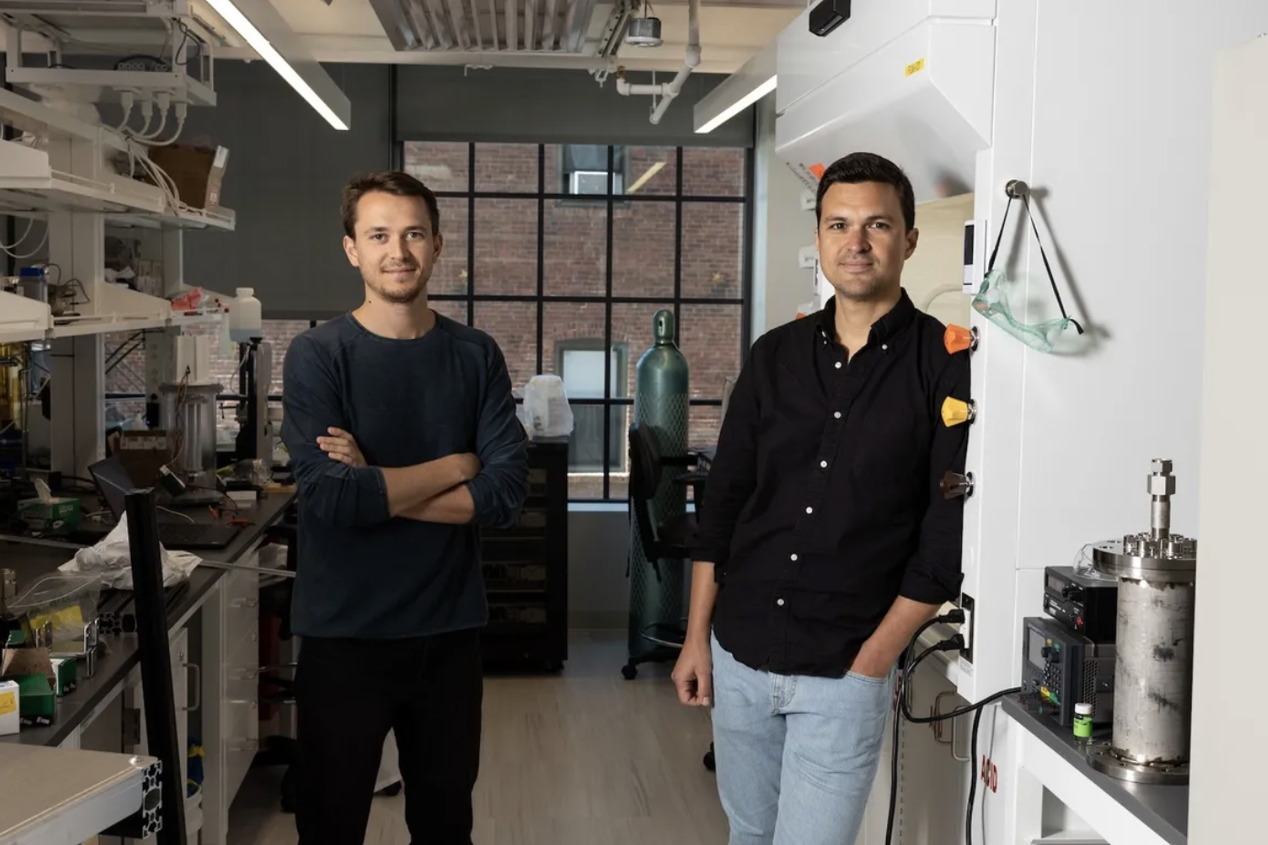 The founders of carbon-neutral aviation fuel company Lydian pose in their lab.